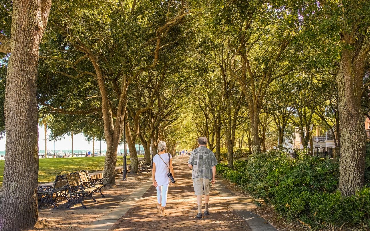 Older couple who are walking in Charleston, SC during September.